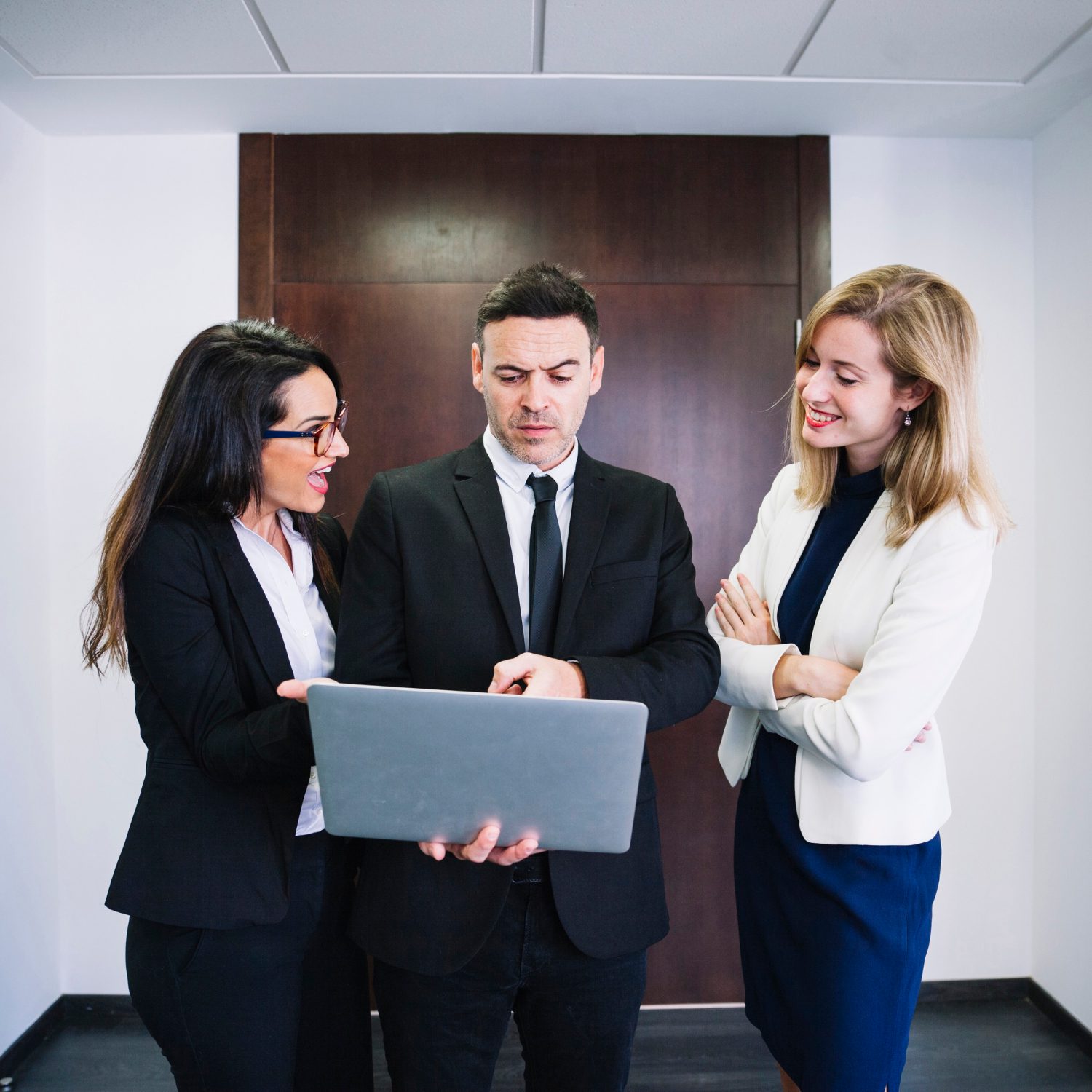 corporate-business-people-looking-laptop